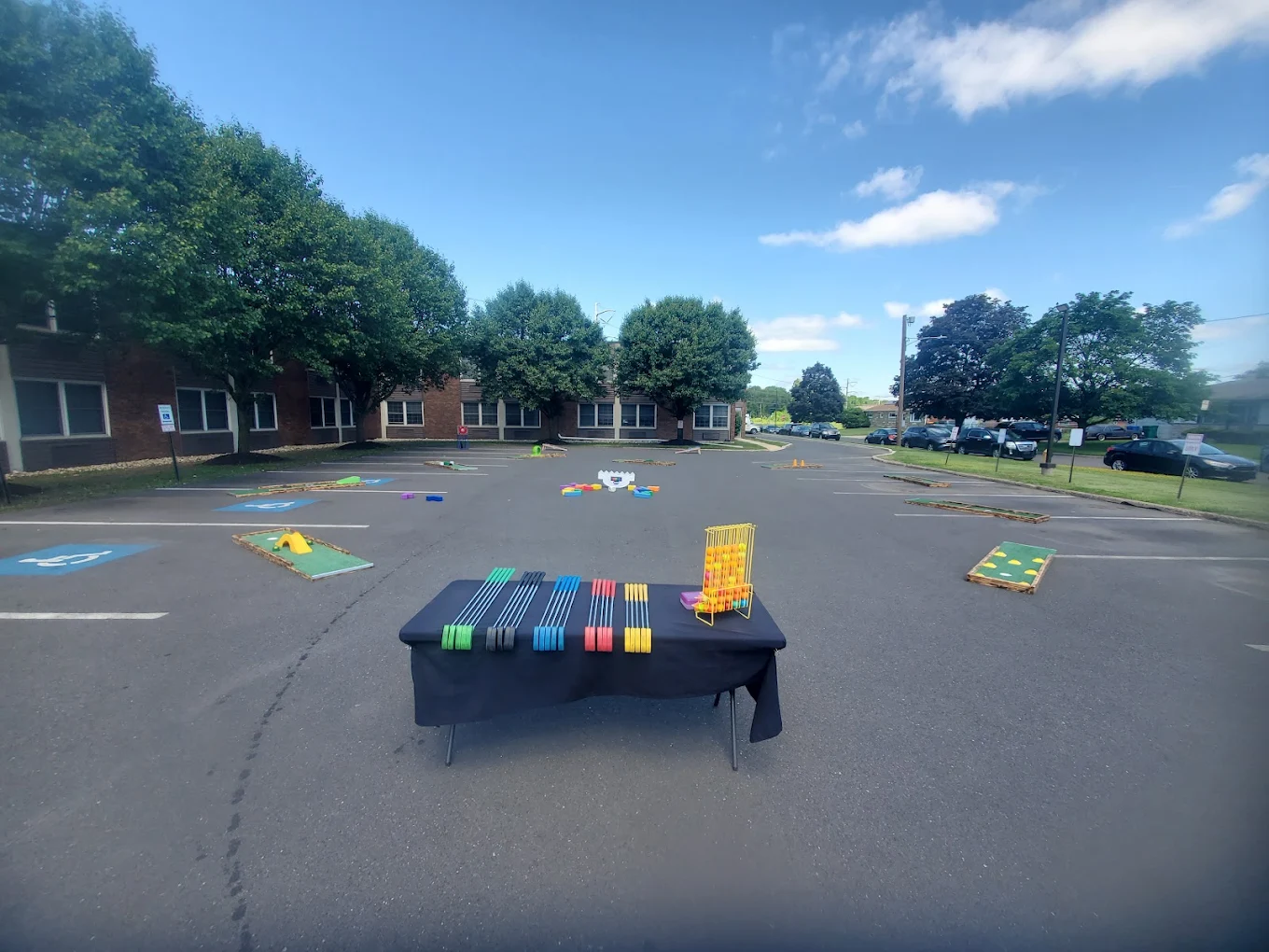 Mini Golf Philly event setup with putters and yard games ready